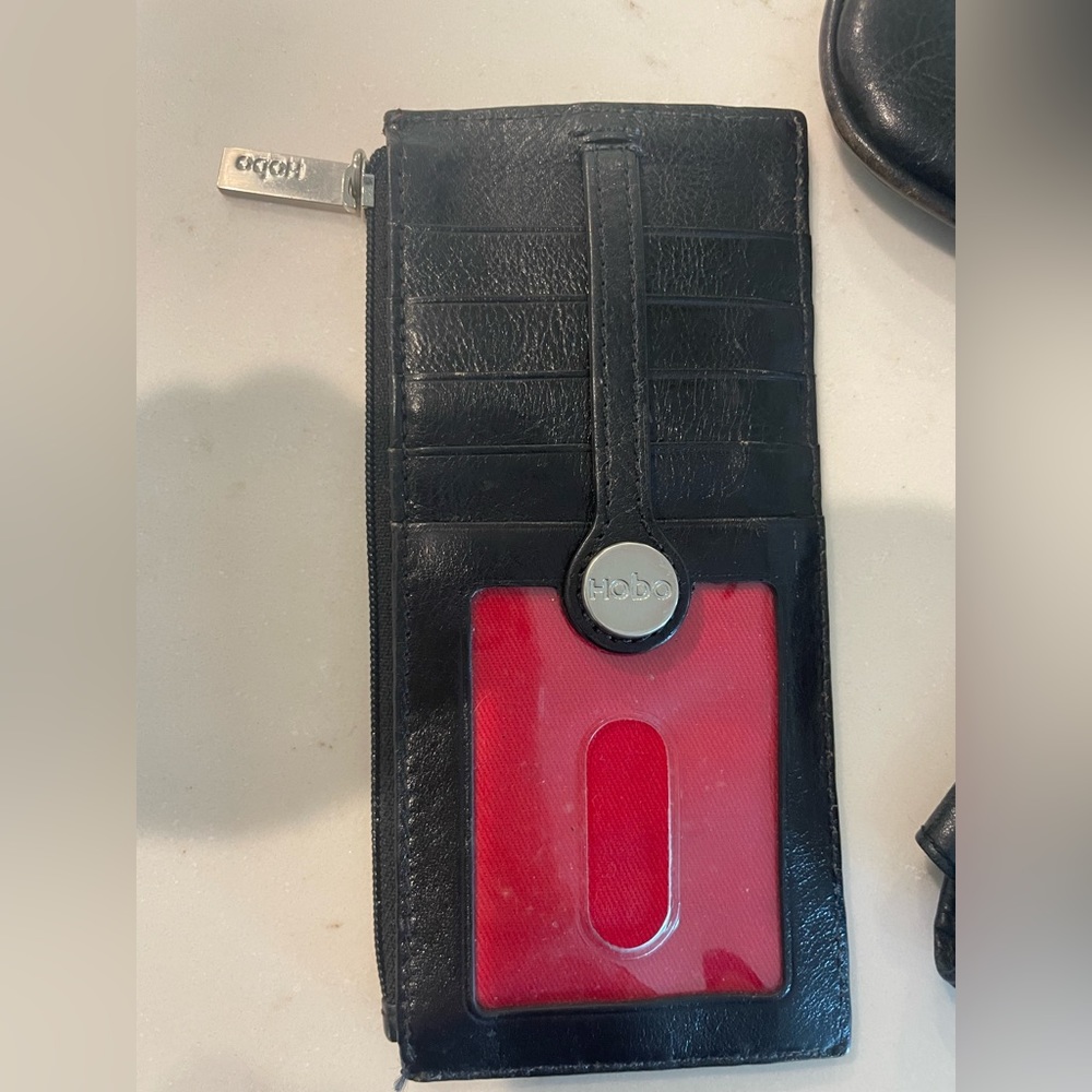 Hobo credit card holder. Black leather with red liner.